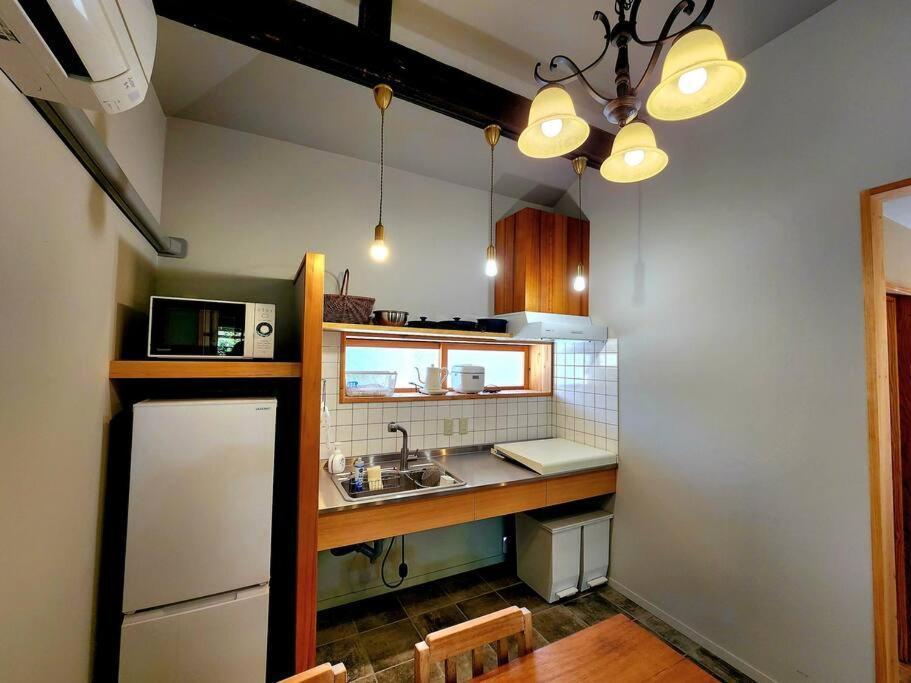 琉球古民家 蒼 Appartement Motobu Buitenkant foto