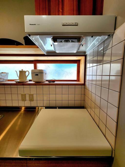 琉球古民家 蒼 Appartement Motobu Buitenkant foto